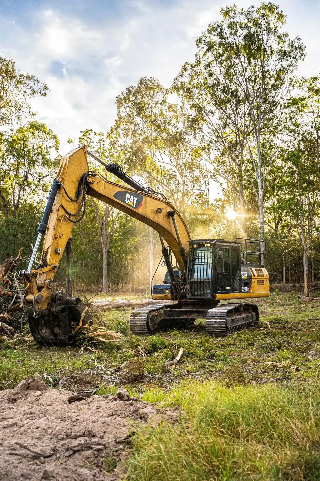 Tree Eaters excavator working into the sunset