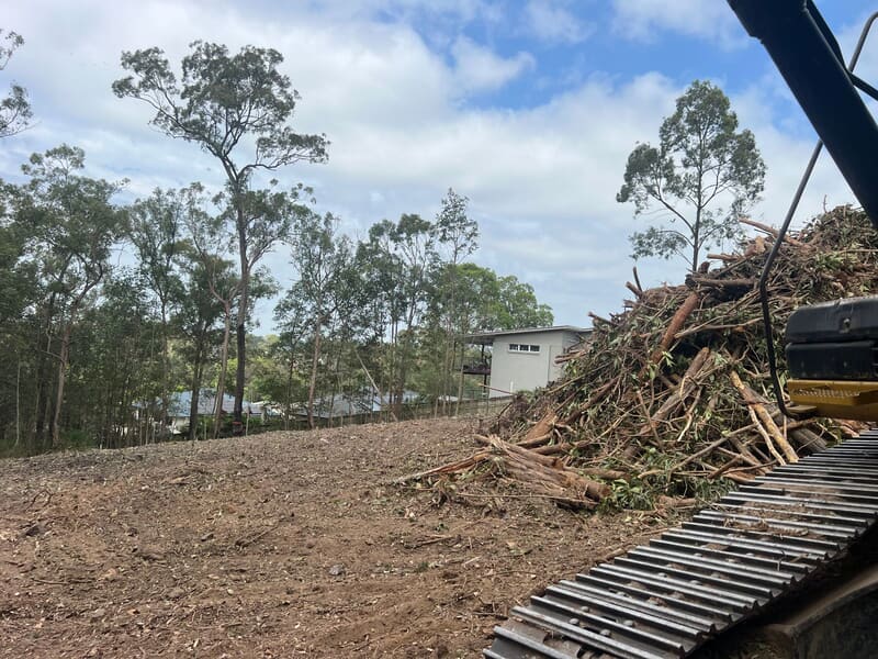 Residue stacked in a single pile beside the cleared Browns Plains pad