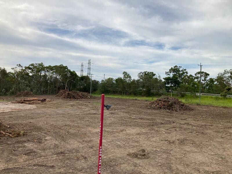 Cleared Old Pub Lane site with sawlog stacked and residue windrowed