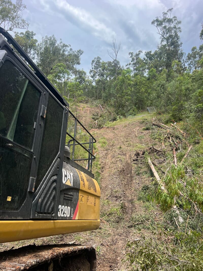 CAT 329D working uphill along the pipeline easement